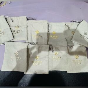 Kendra Scott Cream Pouches with Gold Logo